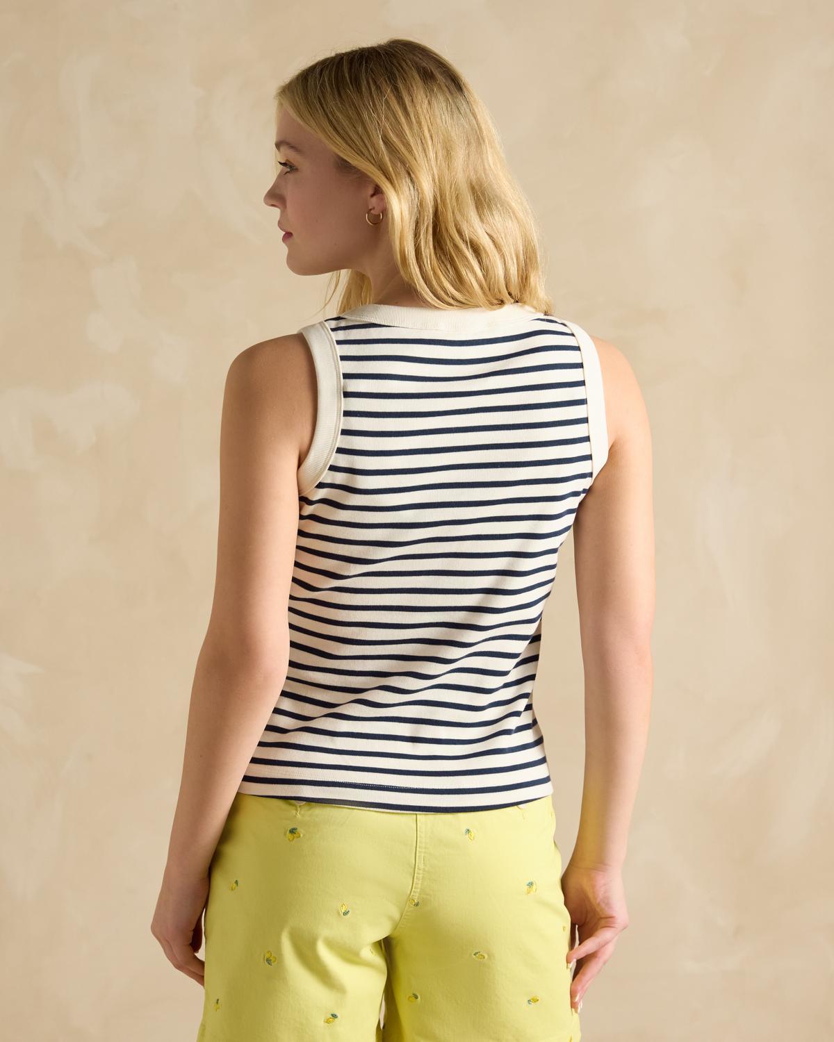 JOULES HARBOUR VEST CREME NAVY: Woman in striped tank top and yellow lemon shorts from Equiflair.