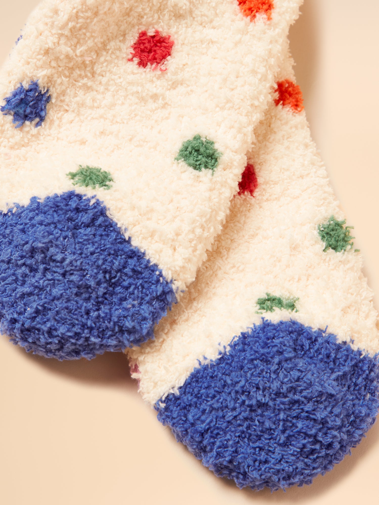 Joules Creme Spot Fluffy Socks: Soft, polka dot socks with blue heel and toe. Warm, cozy and stylish socks. From Equiflair Store.