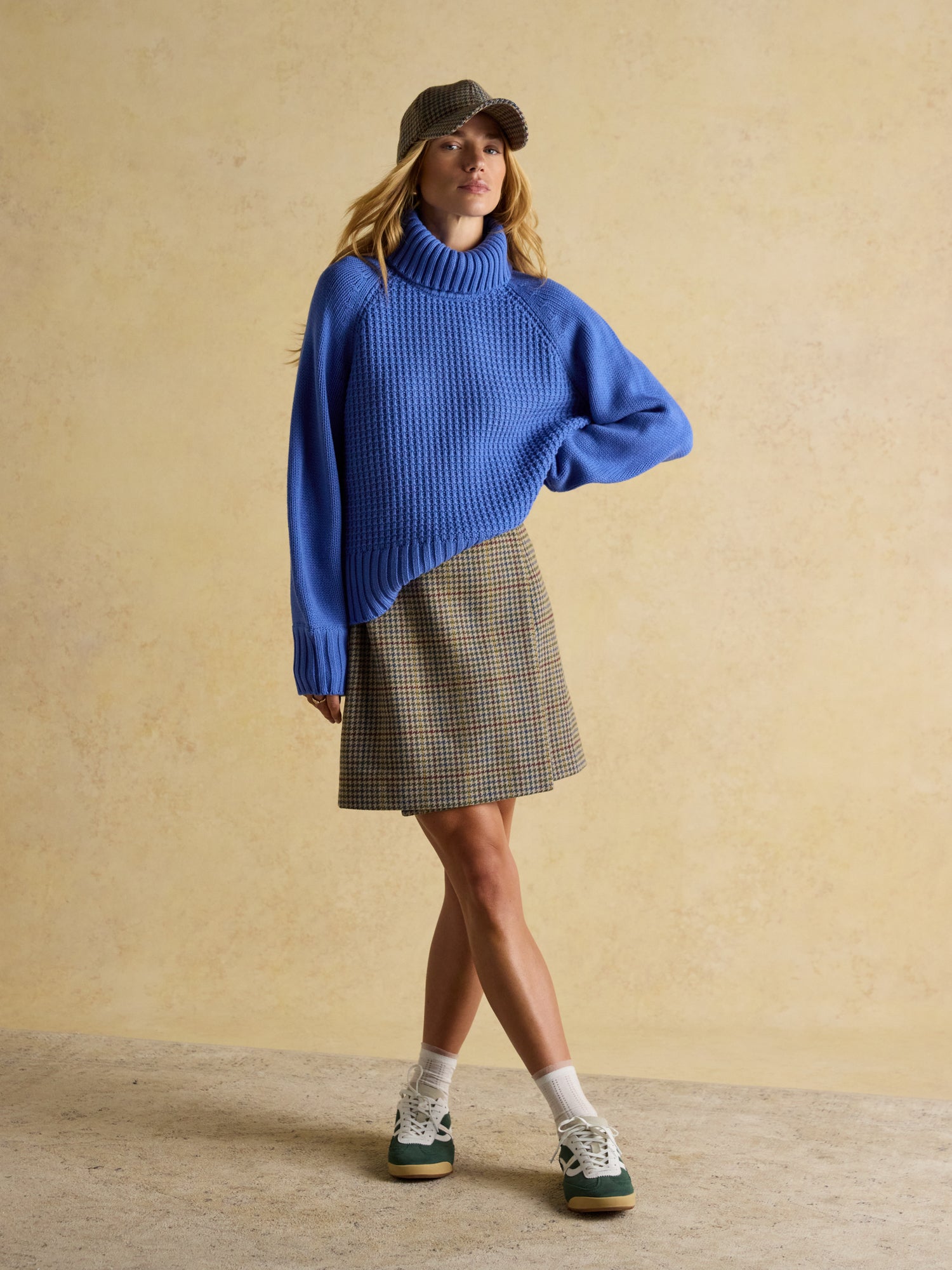 JOULES CARY BLUE KNITTED JUMPER with detachable roll neck worn with skirt and trainers. Modern, stylish women's fashion.