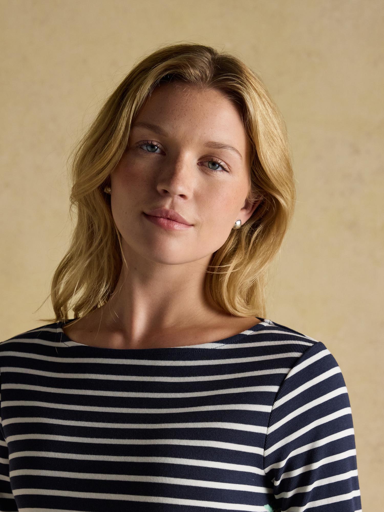 Joules Festive Harbour Breton Top: Woman in Navy/Cream Striped Boat Neck Shirt by Equiflair