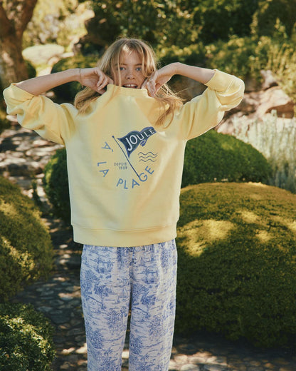 Joules yellow sweatshirt with "A la Plage" graphic & printed pants. Women's fashion from Equiflair.