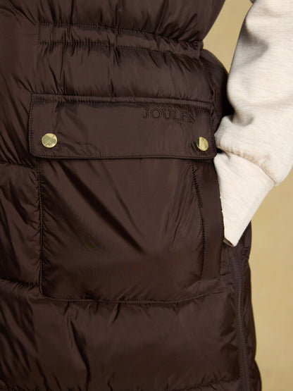 Women's Joules chocolate brown longline puffer vest, showerproof padded gilet for outdoor wear.
