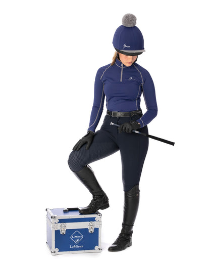 LeMieux Equestrian: Rider in Ink Blue Base Layer, Riding Boots & Helmet. Ready for Riding. 