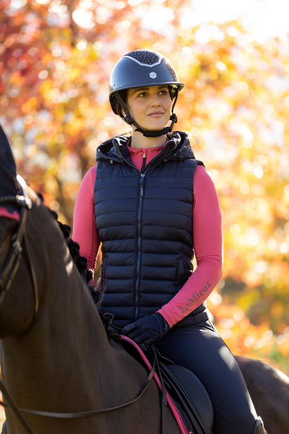 LeMieux Rose Hooded Puffer Gilet Navy: Equestrian Style for Riding. Water-resistant, lightweight, perfect for chilly days! #LeMieux #Equestrian