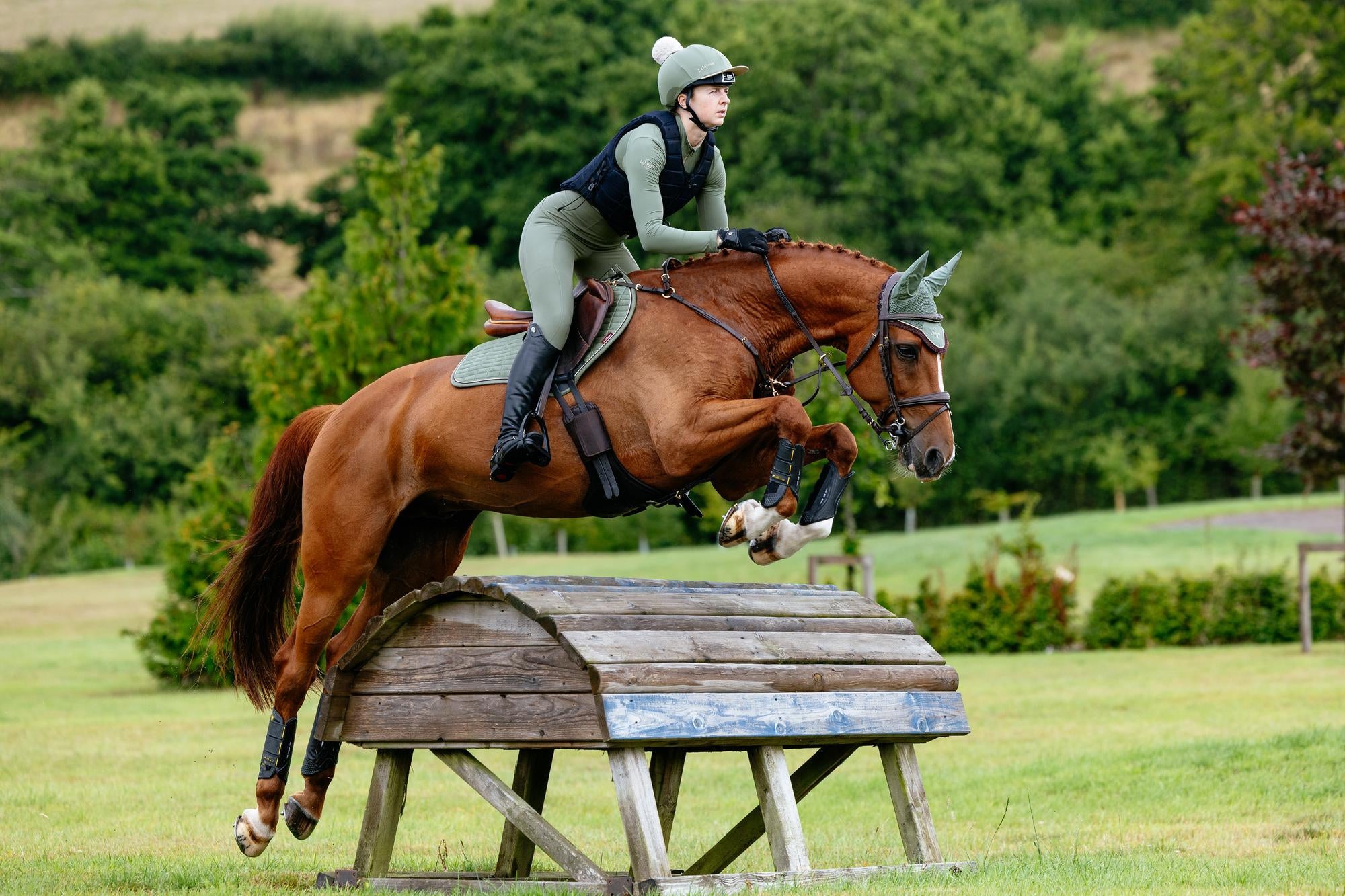 Horse Jumping with LeMieux Suede Close Contact Square Rosemary Saddle Pad