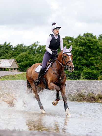 Horse and Rider Riding Splashing with LEMIEUX SUEDE CLOSE CONTACT SQUARE LILAC from Equiflair.