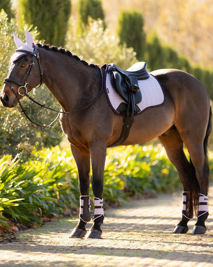 LeMieux Suede GP Square Lilac Saddle Pad: Stylish horse riding gear, featuring lilac saddle pad, matching fly hood and leg protection.