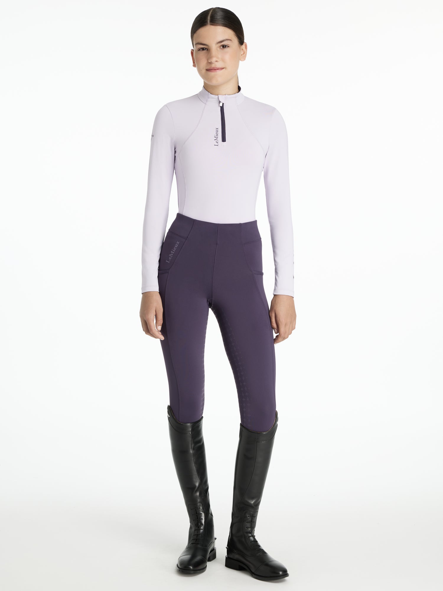 LEMIEUX YOUNG RIDER CLASSIQUE BASE LAYER LILAC: Girl in riding apparel, Long sleeve top with riding leggings and boots