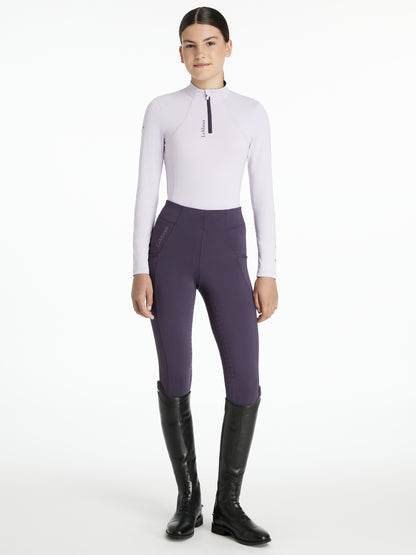 LEMIEUX YOUNG RIDER CLASSIQUE BASE LAYER LILAC: Girl in riding apparel, Long sleeve top with riding leggings and boots