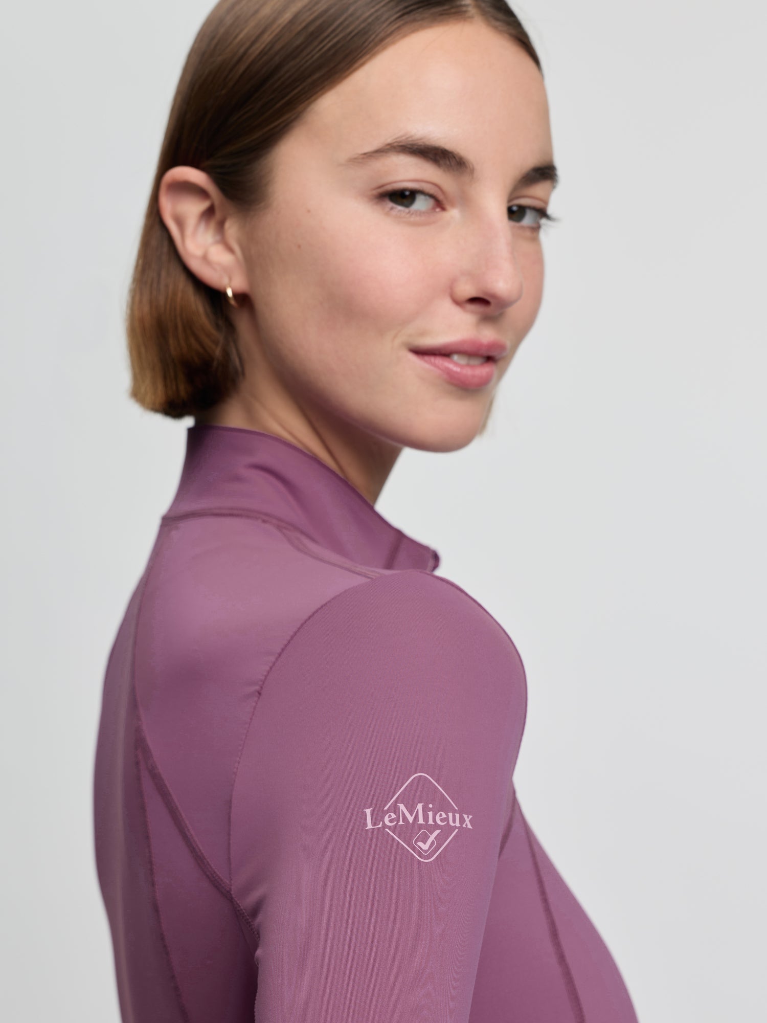 LeMieux Classique Base Layer in Mallow at Equiflair: Women's riding apparel, UV50+ quarter zip, sweat-wicking, 360° stretch comfort.