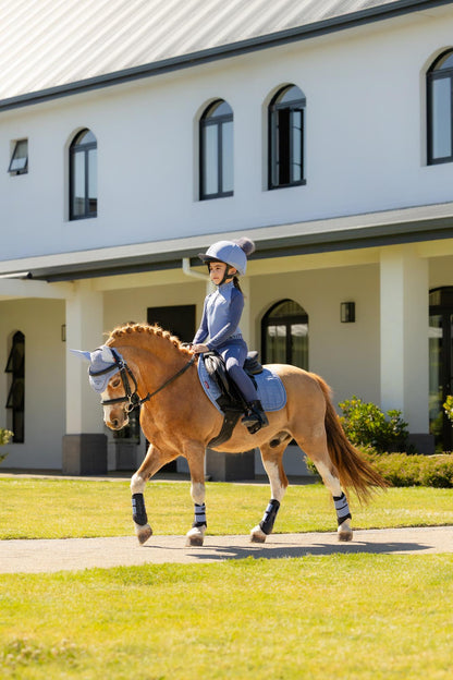 LEMIEUX Mini Suede Close Contact Saddle Pad in Powder Blue on Pony. Equestrian riding attire & gear by Equiflair.