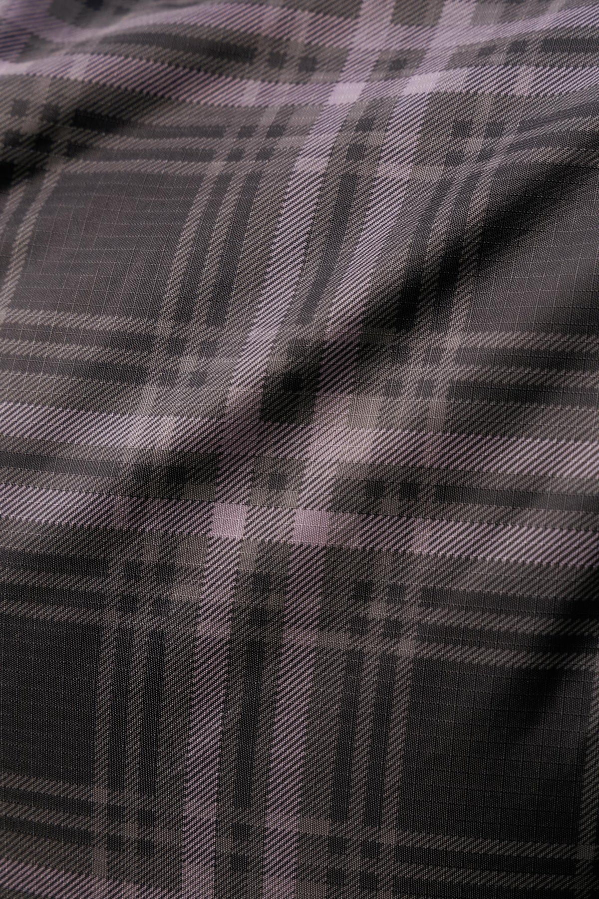 Lemieux Arika Heritage Check equestrian turnout rug in cocoa - close-up of durable polyester fabric.