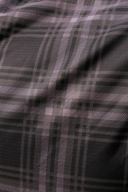 Lemieux Arika Heritage Check equestrian turnout rug in cocoa - close-up of durable polyester fabric.