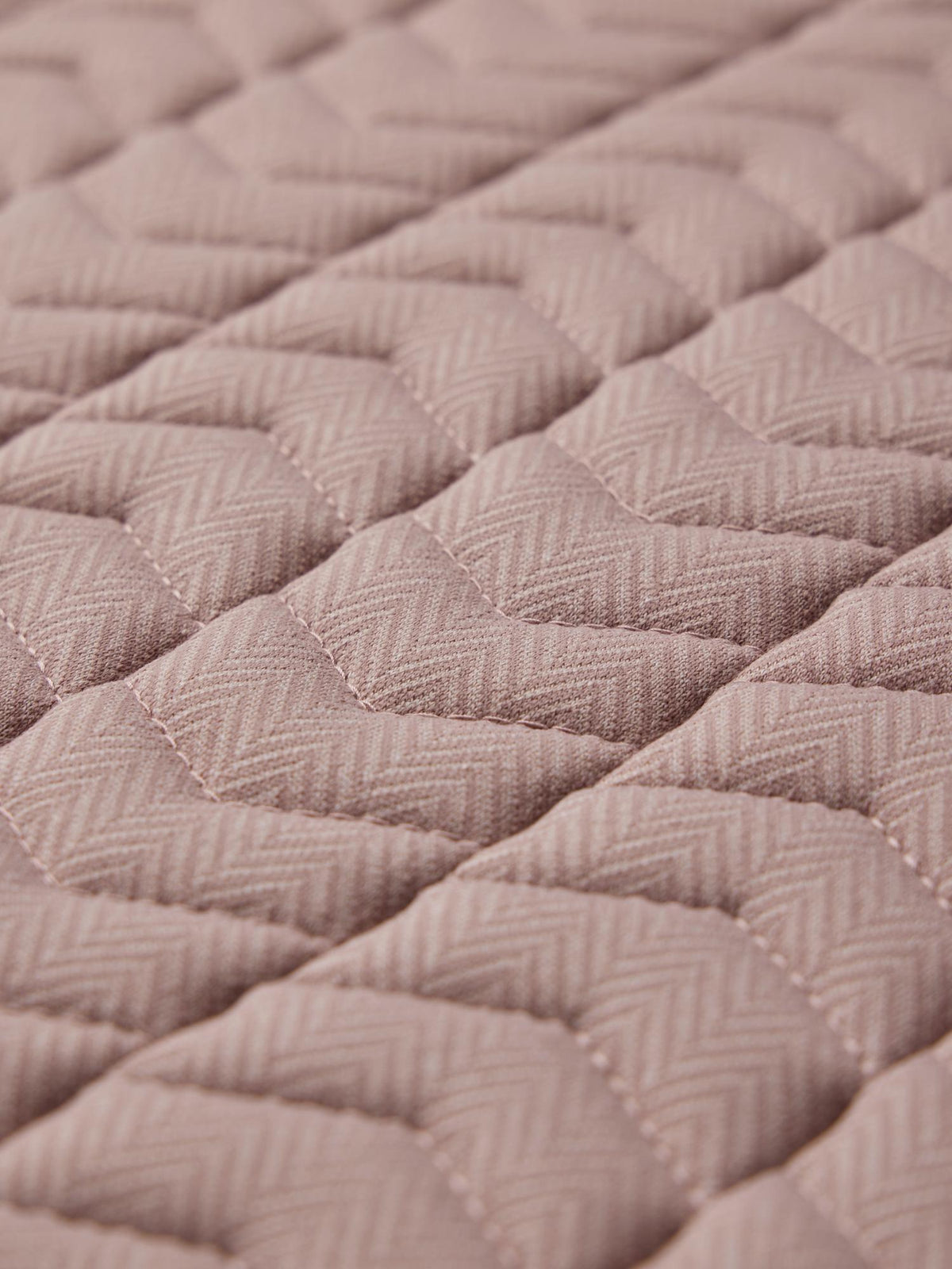 LeMieux Heritage Herringbone Dressage Square saddle pad in Wild Rose, featuring chevron quilting and herringbone fabric.