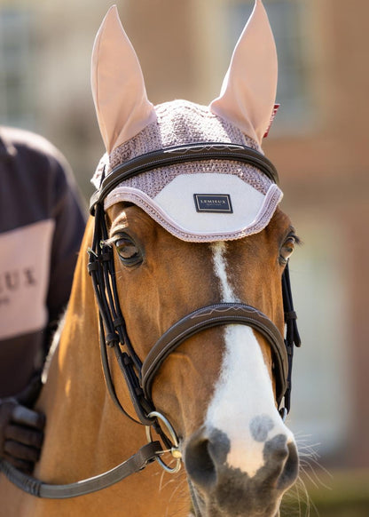 LeMieux Heritage Fly Hood Wild Rose on a brown horse, handmade crochet equestrian ear net.