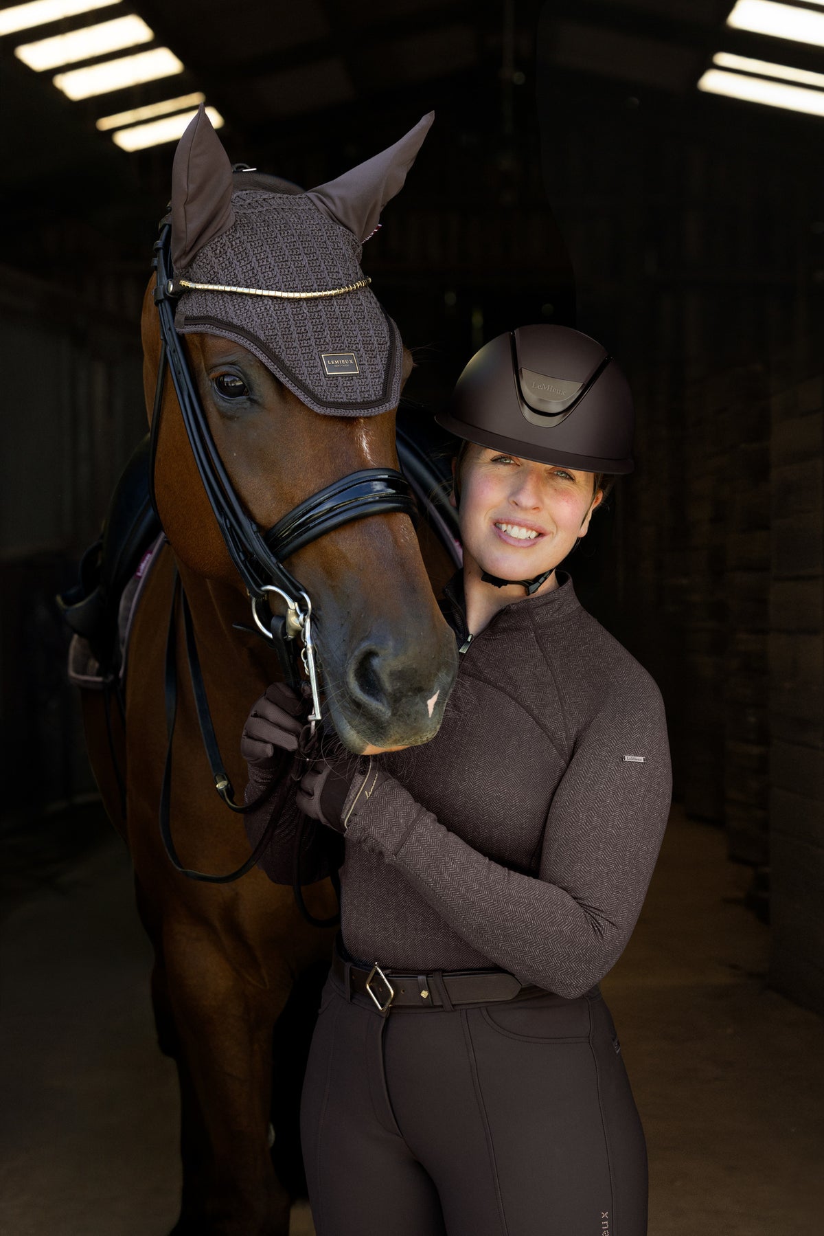 LeMieux Heritage Fly Hood Cocoa: Equestrian rider and horse sporting stylish brown matching gear.
