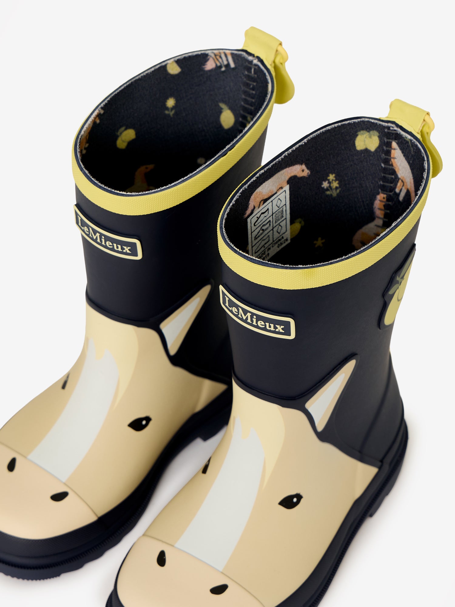 LeMieux kids navy wellies with yellow horse face design and lemon print lining