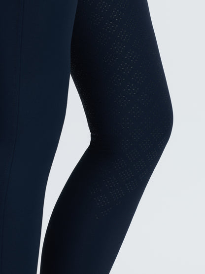 Navy riding breeches with full seat grip and textured knee pattern