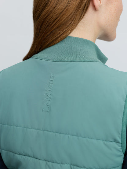 Back view of teal LeMieux Lily Lightweight Gilet in Aloe with embossed LeMieux branding, perfect for equestrian use.
