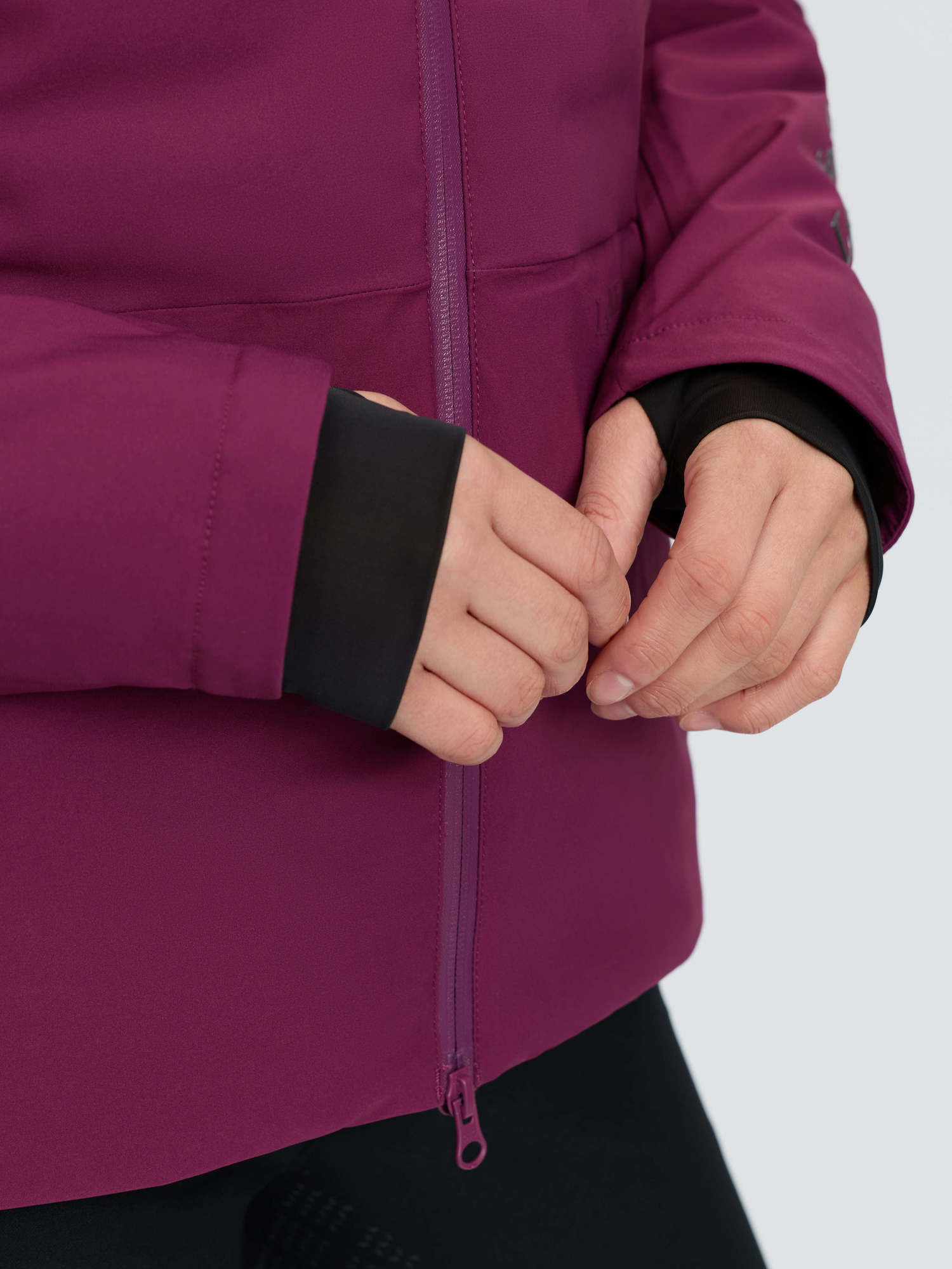 LeMieux Brooke 3-in-1 waterproof hybrid jacket in blackberry, close-up of sleeve and zipper detail.