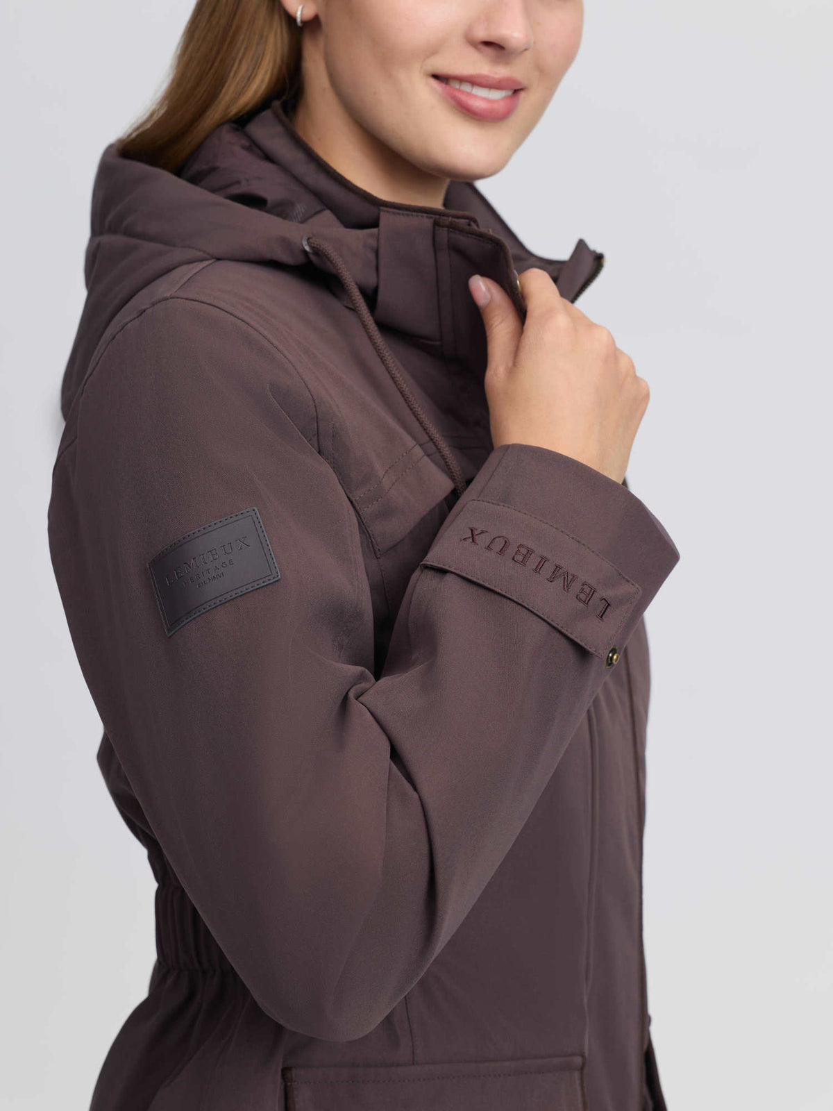 LeMieux Heritage Beatrice Waterproof Coat in Cocoa brown, featuring embroidered logo detail on sleeve and cuff.