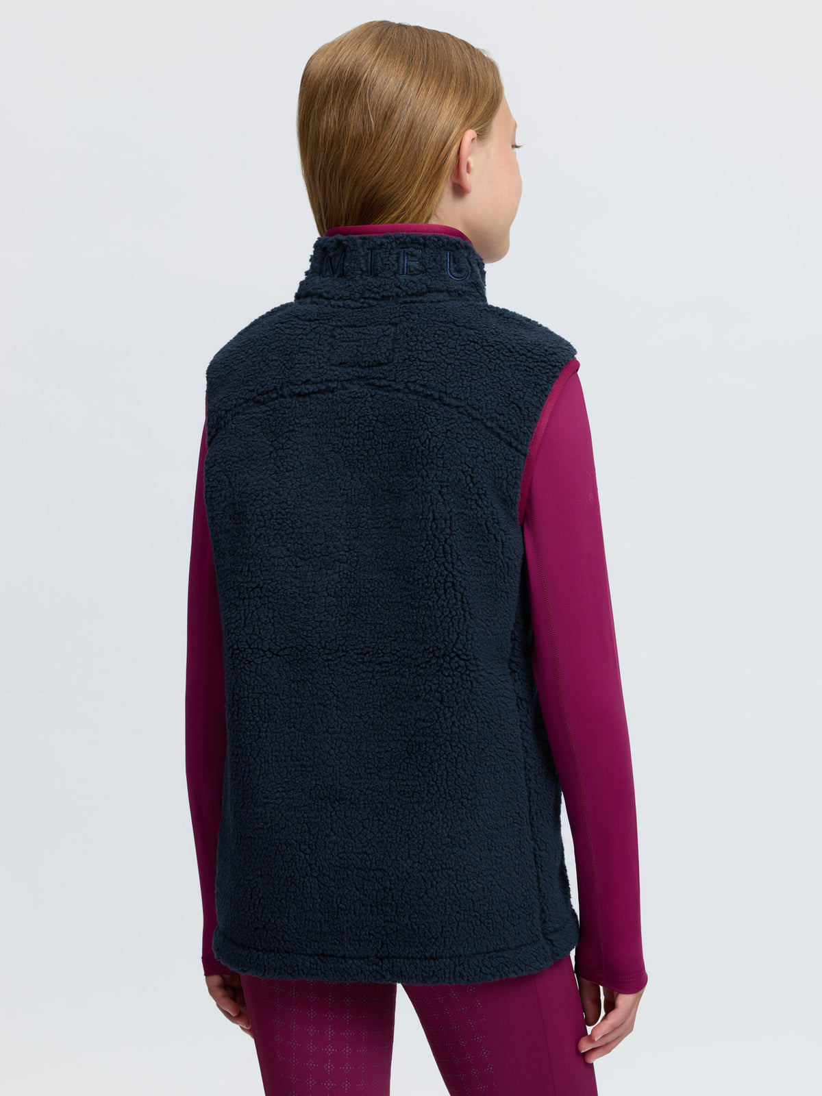 LeMieux Young Rider Navy Borg Fleece Teddy Gilet with contrast trim for equestrian and horse riding.
