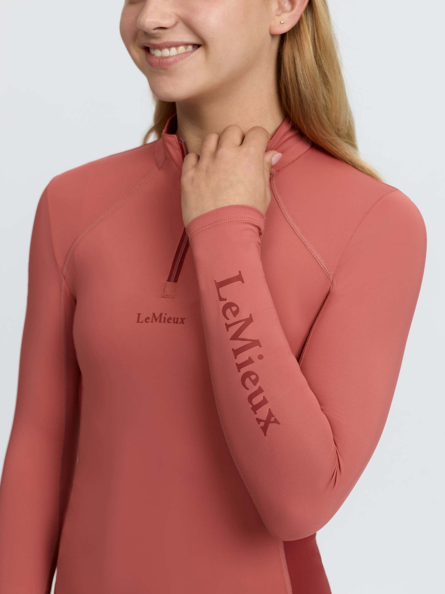 LeMieux Young Rider Classique Base Layer in Spiced Earth. Long sleeve quarter zip top for equestrian activities.