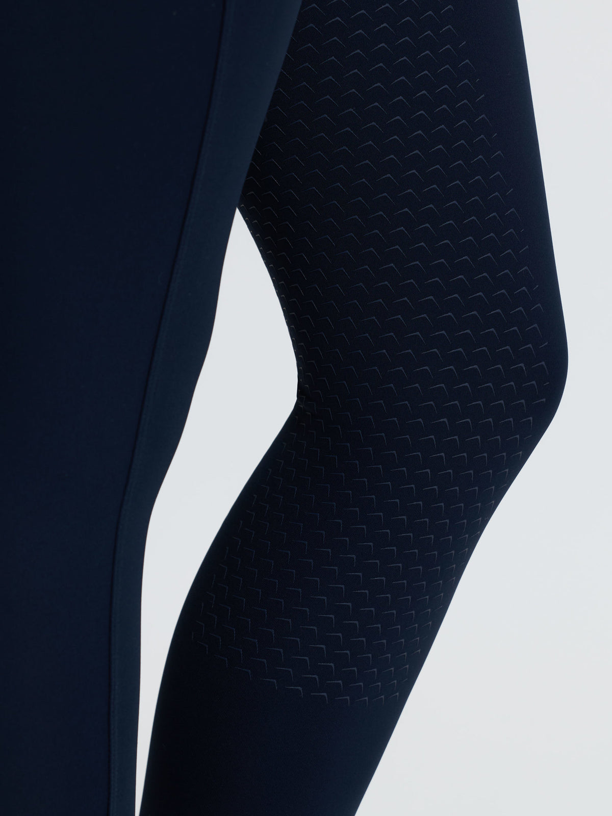 LeMieux Young Rider Nell navy brushed riding leggings with patterned silicone full seat.