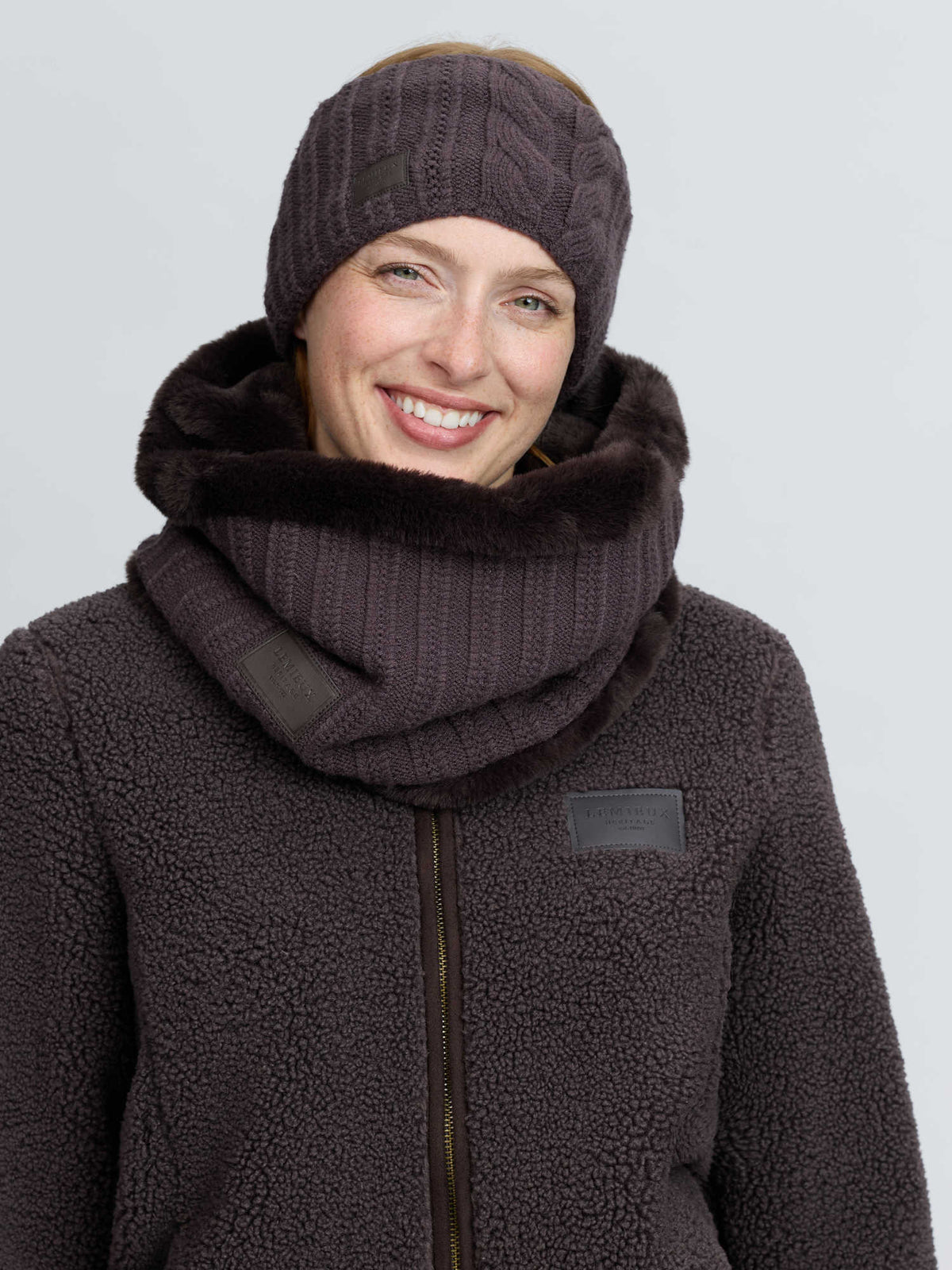 LeMieux Heritage knitted snood in cocoa worn by a woman with matching fleece jacket from Equiflair