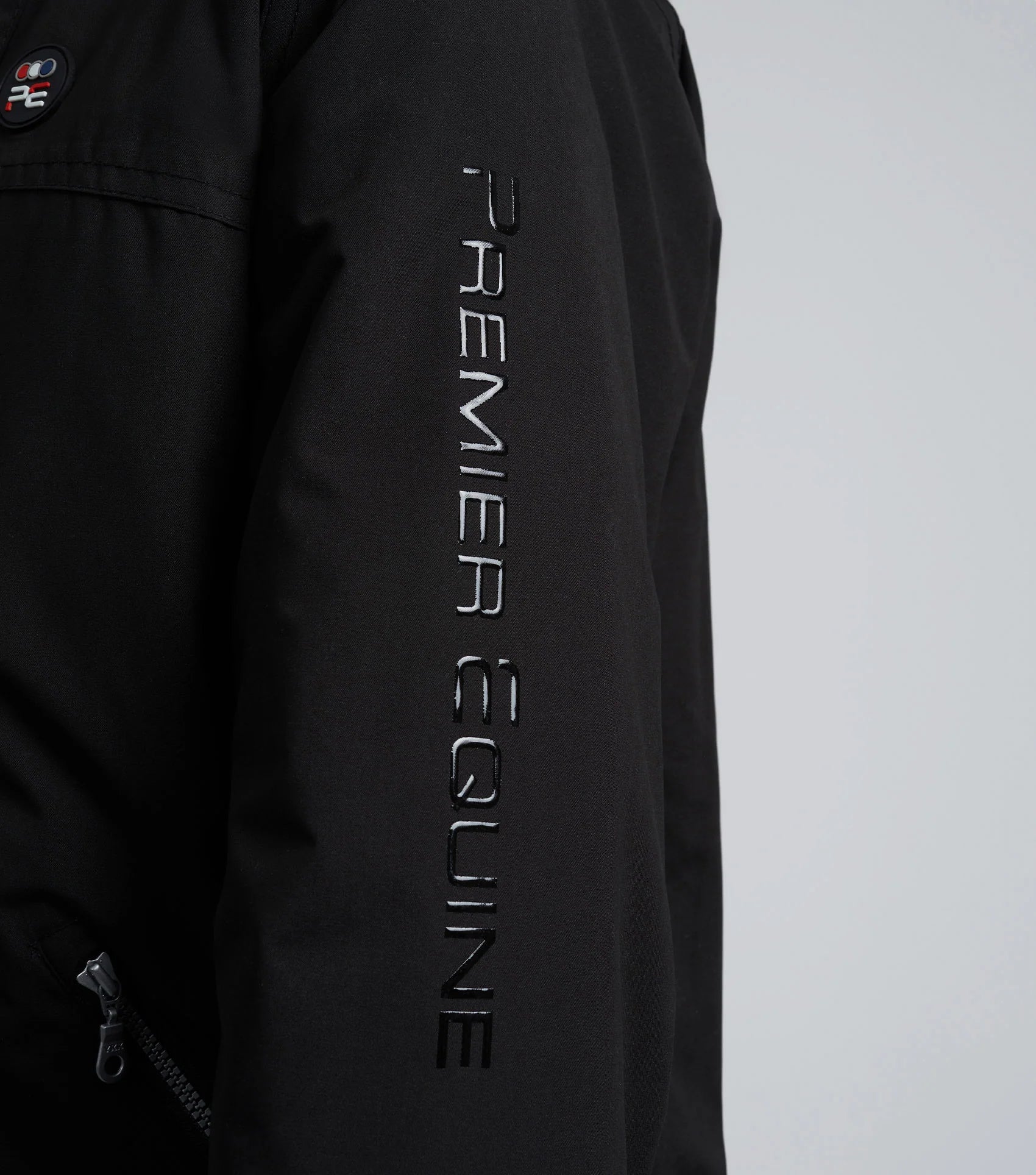 Premier Equine Junior Black Riding Jacket: Waterproof, Breathable, & Stylish Outerwear for Young Equestrians