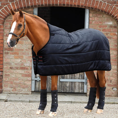 Equiflair: Premier Equine 100G Lucanta Black Horse Rug Liner & Stable Boot Wraps. Horse wearing black rug and leg wraps.