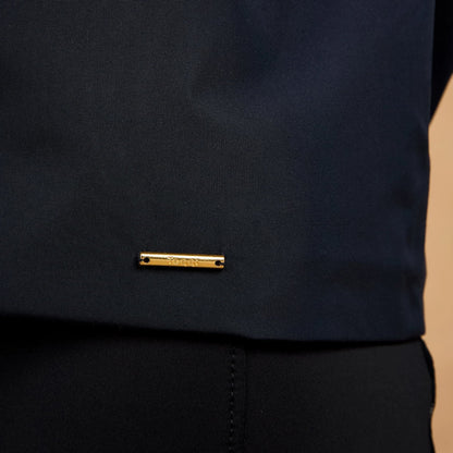 TOGGI Meyer women's navy blue waterproof blouson jacket with gold logo detail.