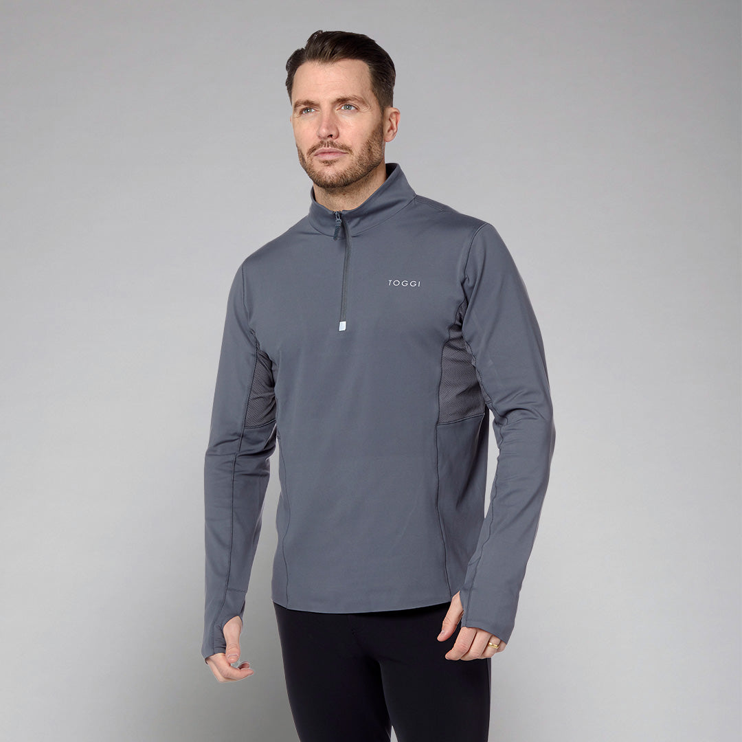 Toggi Men's Reflector Technical Base Layer with quarter zip and thumbholes.