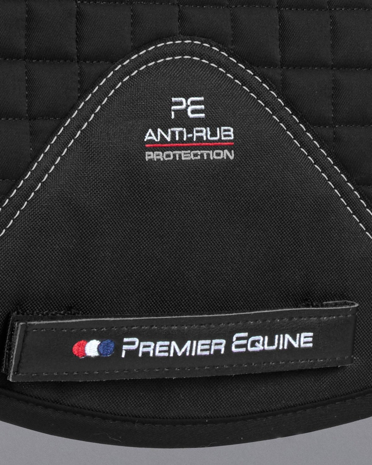Premier Equine Saddle Pad: Black Anti-Rub Numnah, Logo Detail. Equestrian Horse Riding Equipment.