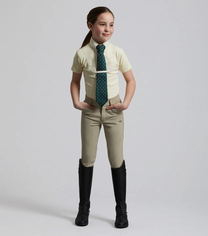 Girl in Premier Equine Luciana Show Shirt: Equestrian riding apparel, short sleeve, competition attire, youth riding clothes.