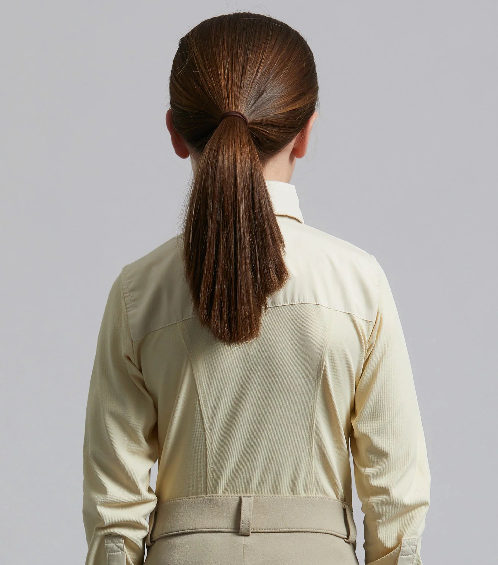 Premier Equine Tessa Girls Beige Show Shirt. Equestrian riding apparel. Long sleeve button-down shirt with ponytail.