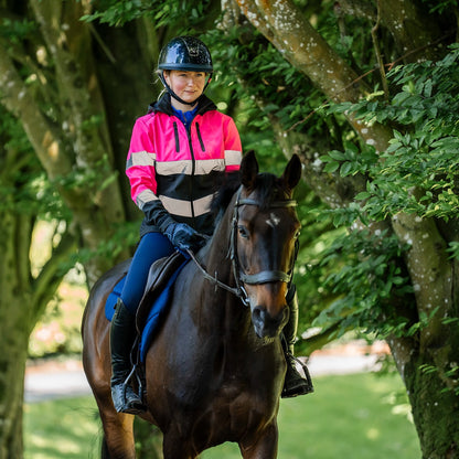 Girl on Horse in Equiflair Hi Viz Riding Jacket Pink - Water Repellent & Reflective. Safety First!