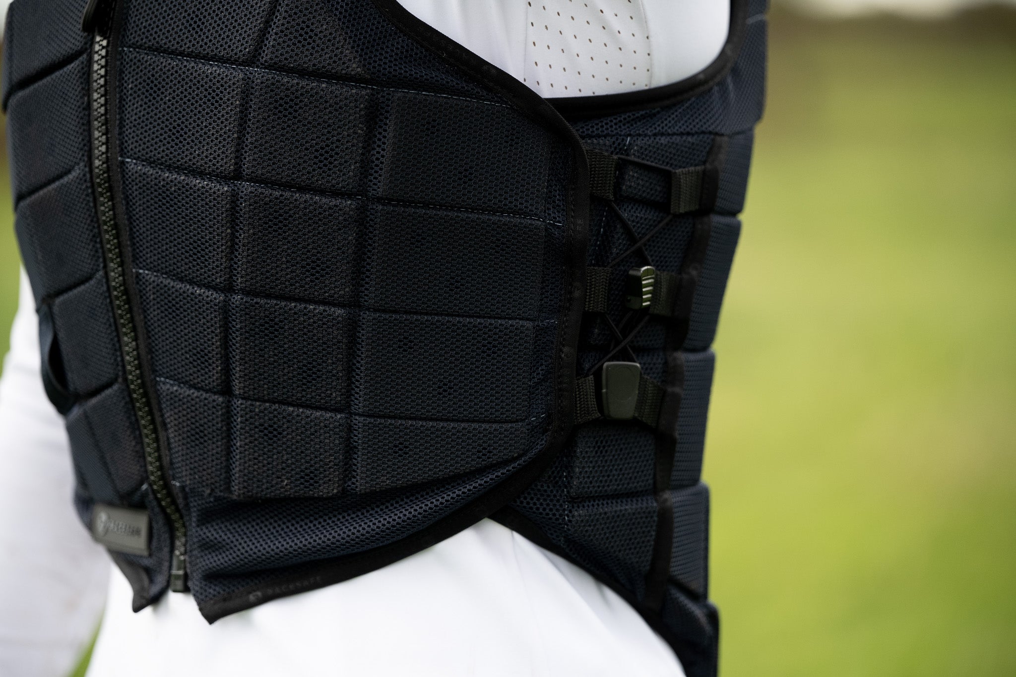 RACESAFE MOTION 3 Body Protector: Black equestrian safety vest with segmented design and adjustable straps.