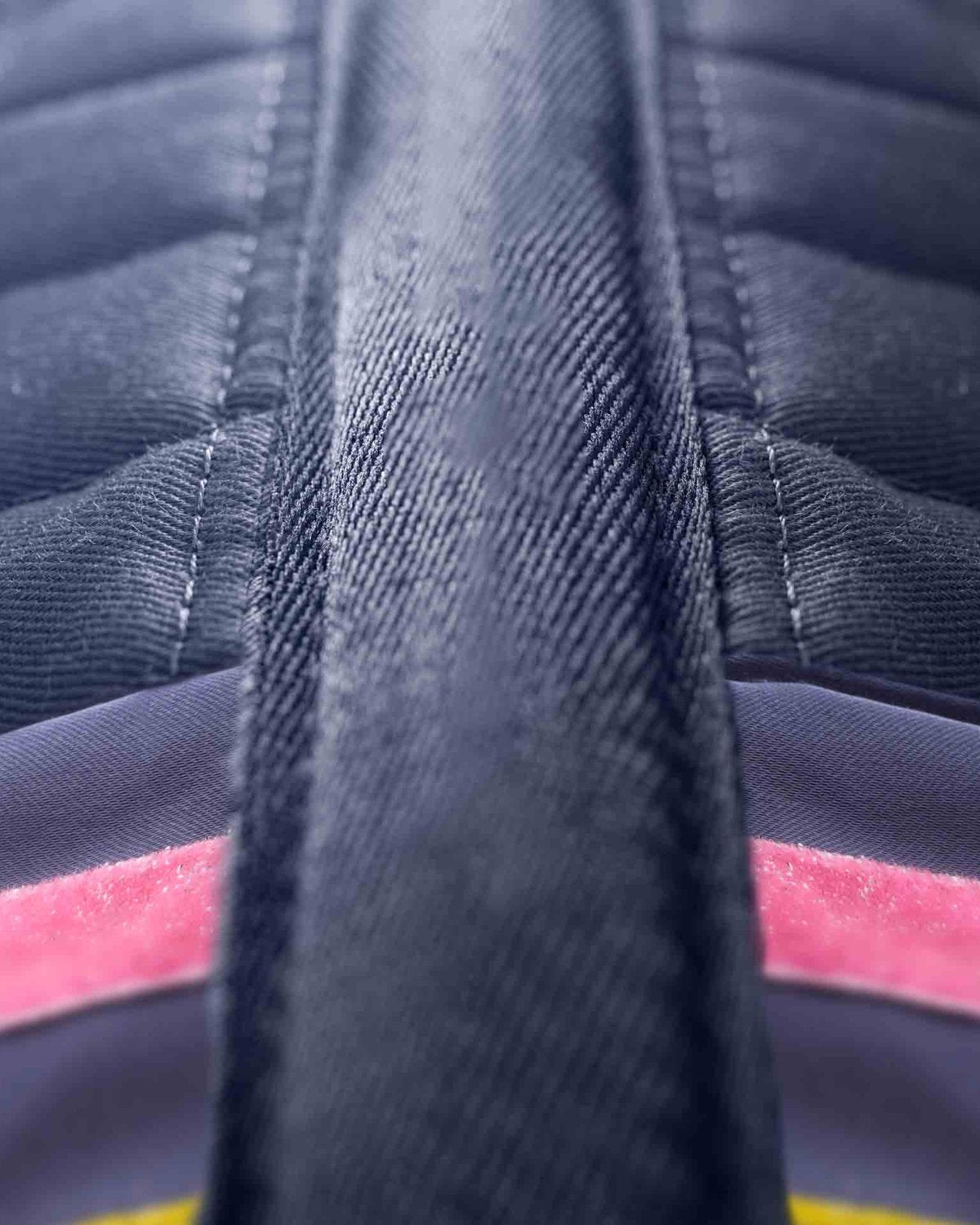 Close-up: Premier Equine My Pony Jack Navy Glitter Saddle Pad. Focus on quilting, stripe detail, & denim-like texture. Equiflair.