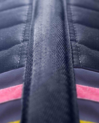 Close-up: Premier Equine My Pony Jack Navy Glitter Saddle Pad. Focus on quilting, stripe detail, & denim-like texture. Equiflair.