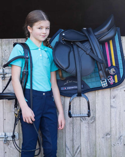 Child equestrian with horse saddle & bridle by Premier Equine My Pony Jack saddle pad turquoise | Equiflair