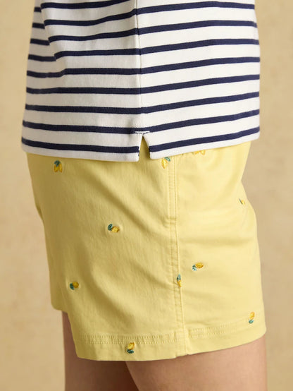 Joules Striped Top & Yellow Pineapple Shorts: Stylish summer outfit.