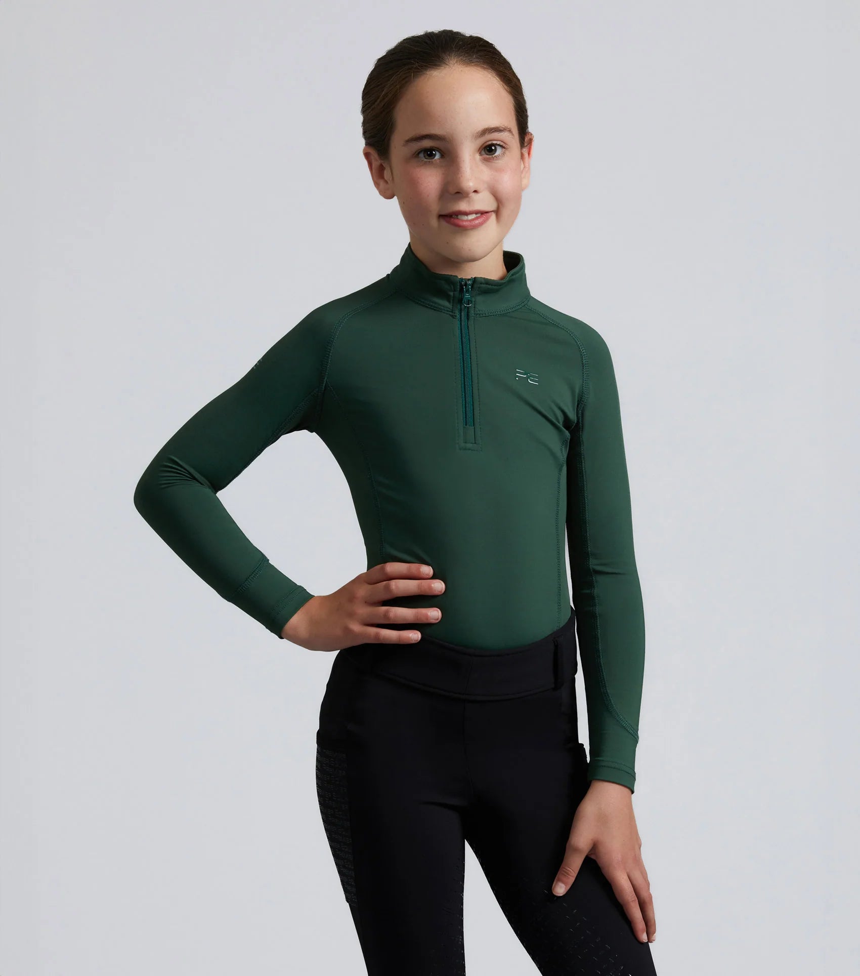 Junior Equestrian Riding Top - Premier Equine Green Technical Shirt. Girl in Horse Riding Apparel