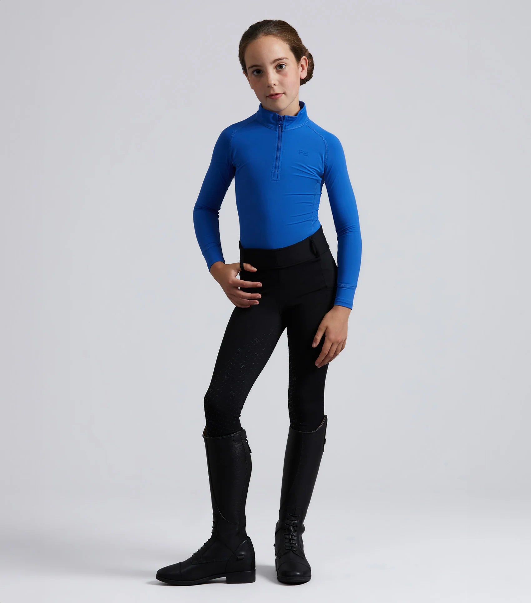 Girl in Premier Equine Junior Riding Top - Royal Blue Equestrian Apparel, Technical Shirt, Moisture-Wicking