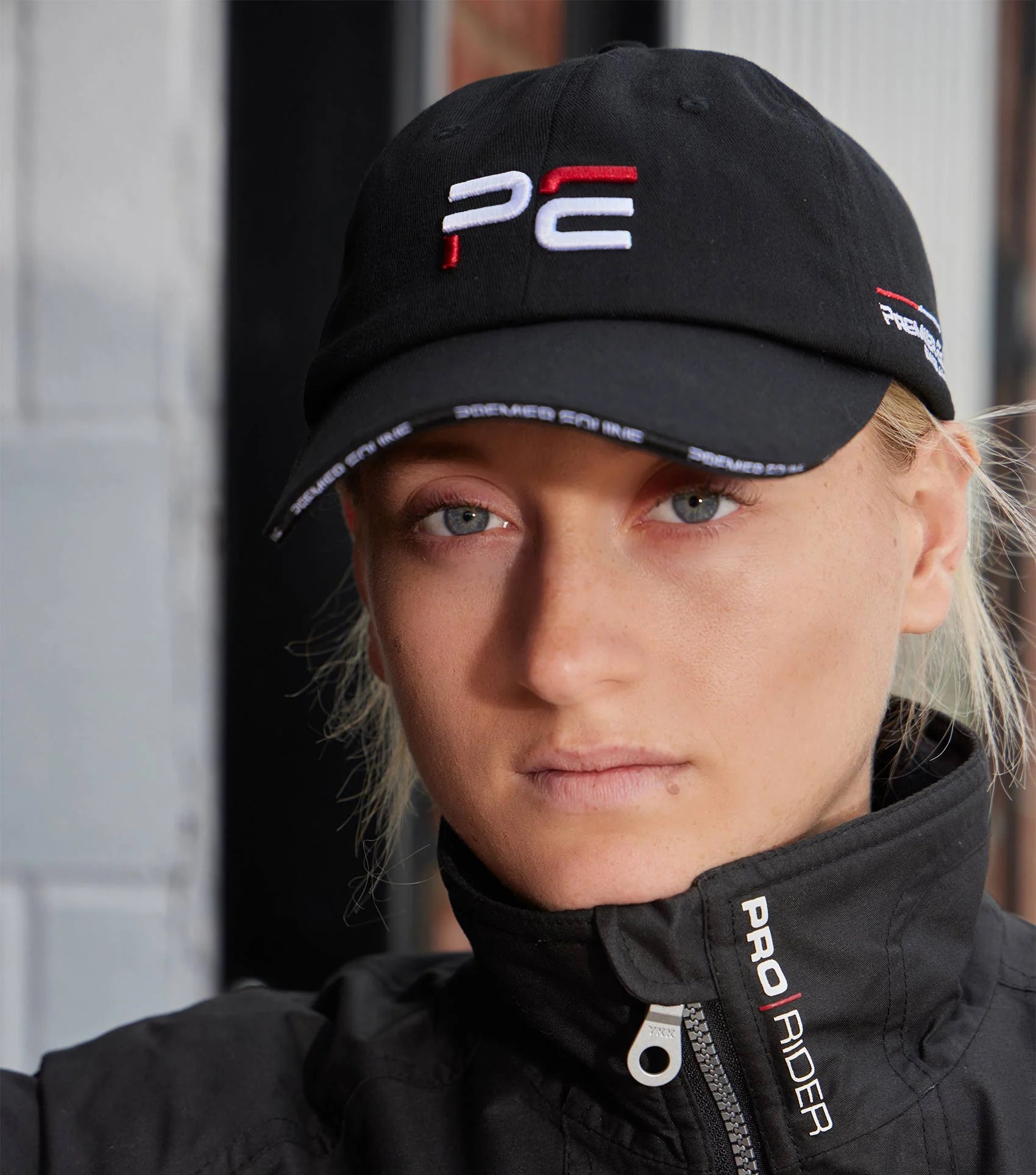 Premier Equine Black Baseball Cap: Stylish Embroidered PE Logo, Adjustable Fit for Riders & Equestrian Enthusiasts