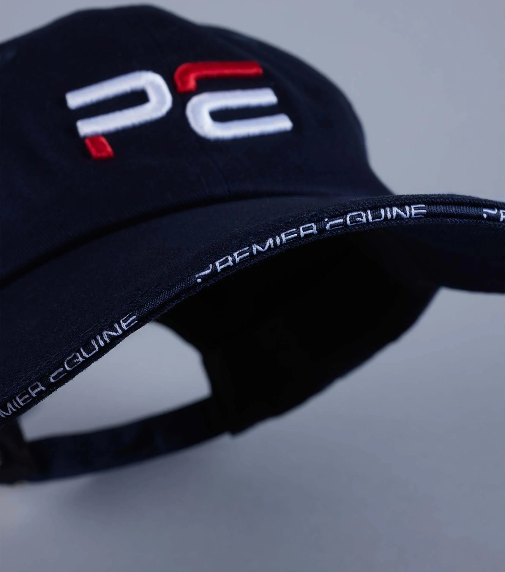 Premier Equine Navy Baseball Cap: Embroidered Logo, Adjustable Fit. Stylish Horse Riding Cap.