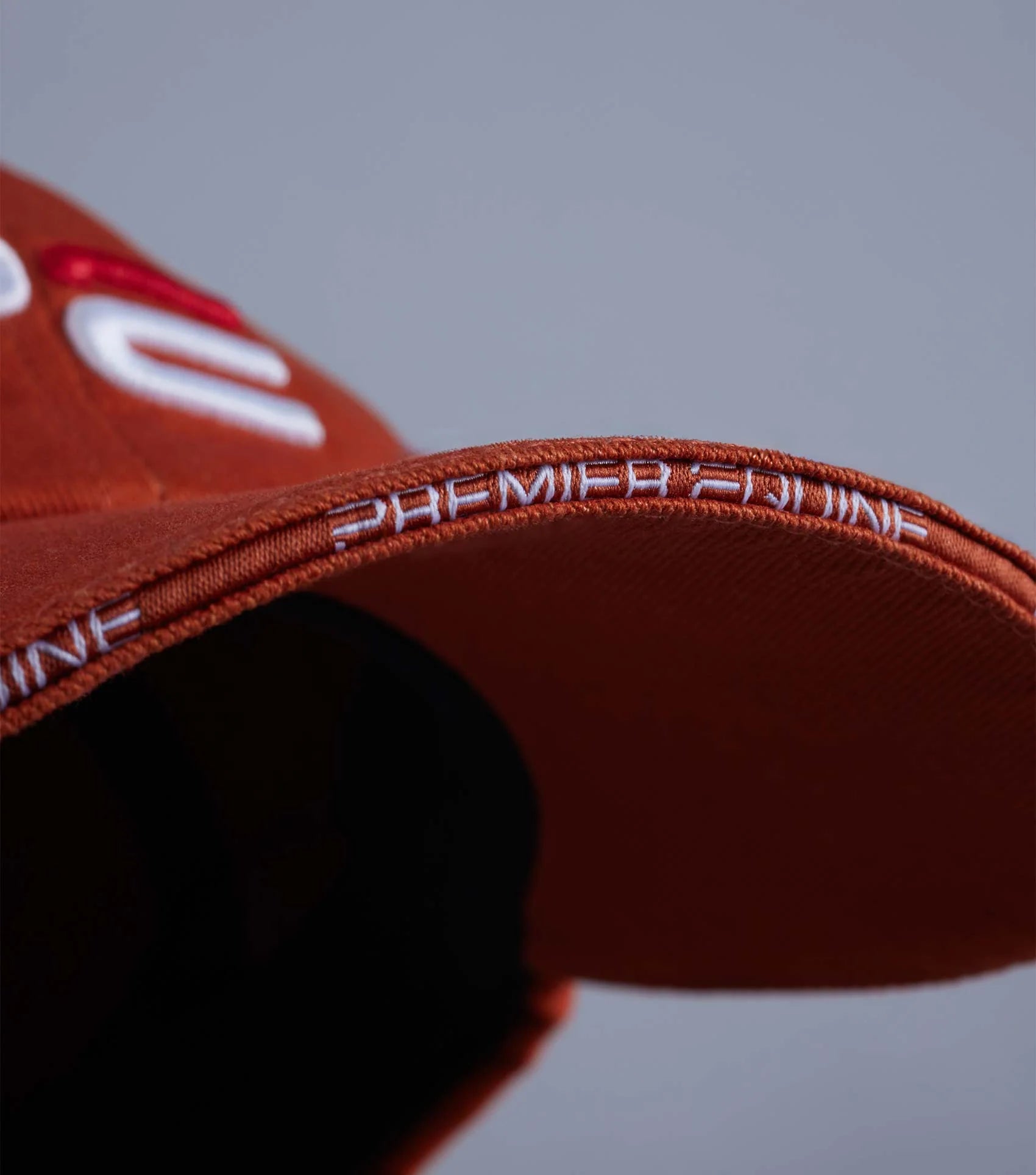 Premier Equine Burnt Orange Baseball Cap: Embroidered Logo, Adjustable Strap. Stylish Equestrian Headwear.