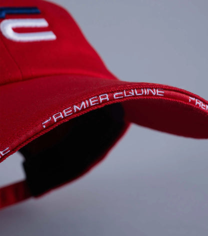 Premier Equine Red Baseball Cap: Embroidered logo, adjustable fit. Equiflair Equestrian sports apparel.