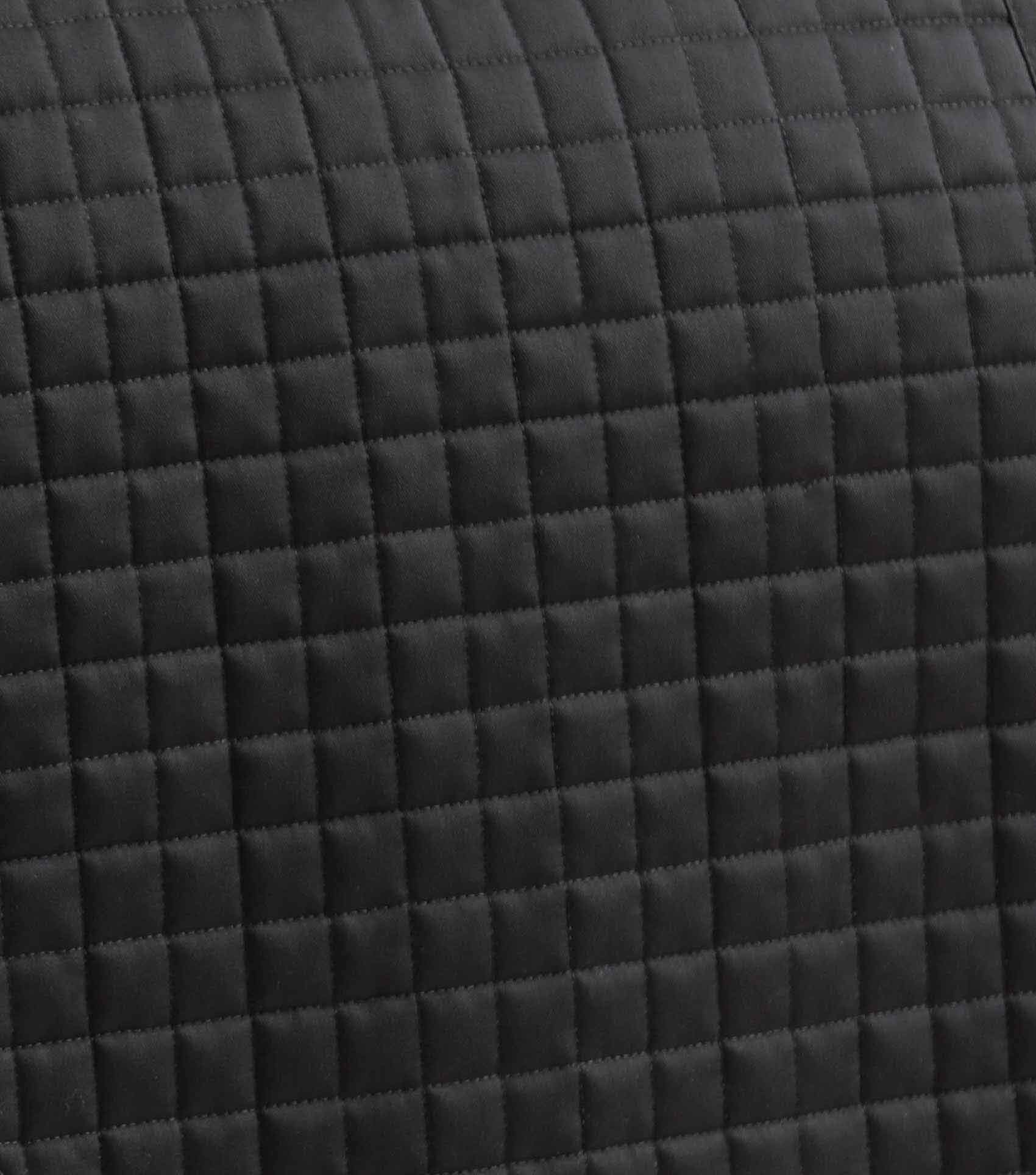 Close-up: Black Quilted Pony Dressage Saddle Pad - Durable & Stylish Equestrian Tack