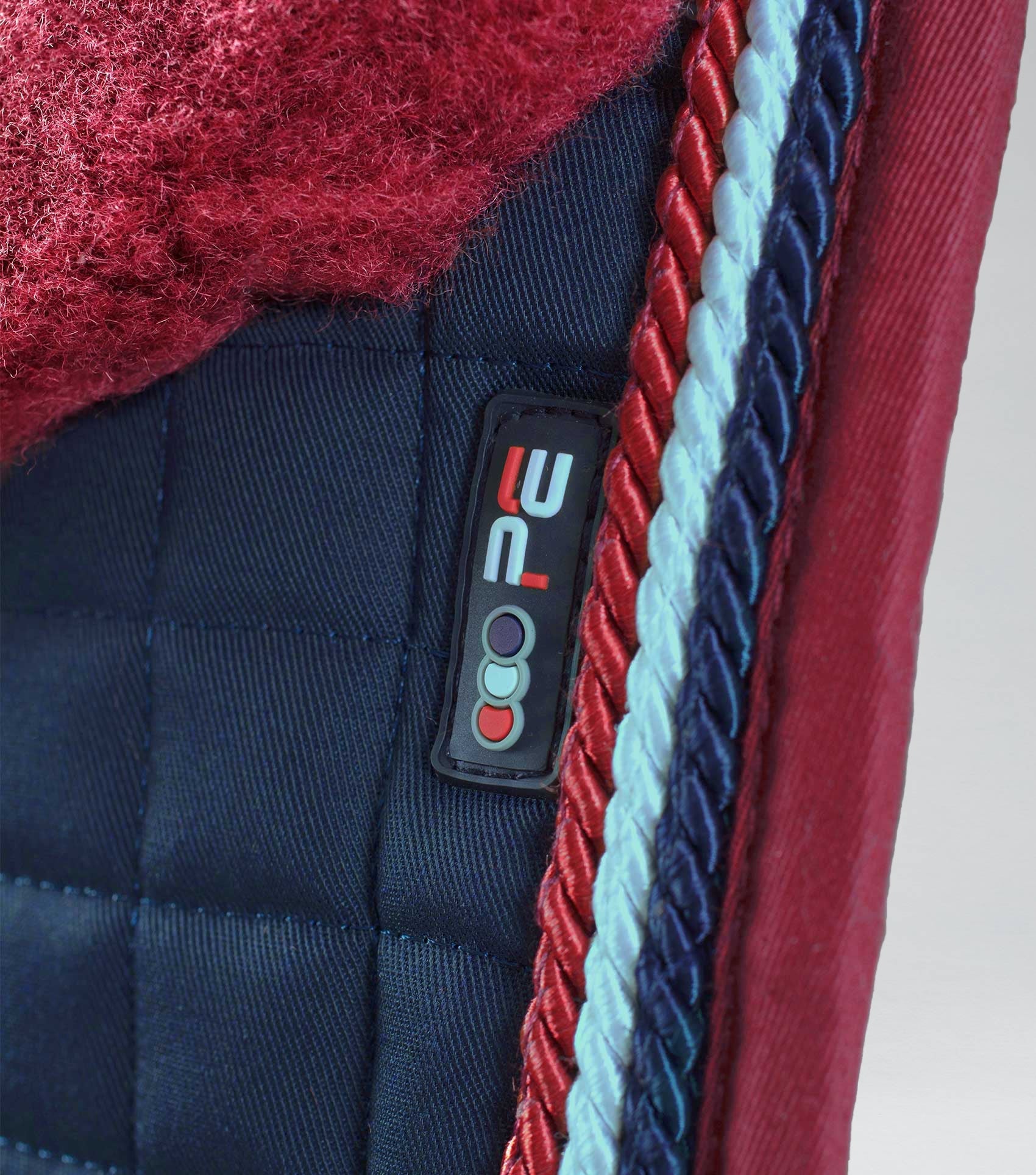 Premier Equine Pony Saddle Pad - Navy/Burgundy Merino Wool European GP/Jump Square - Close Up